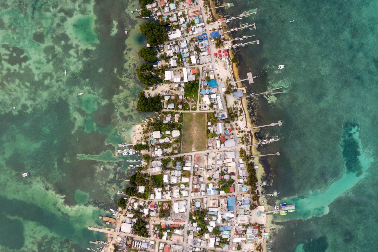 Aerial view of a narrow island town lined with wooden docks